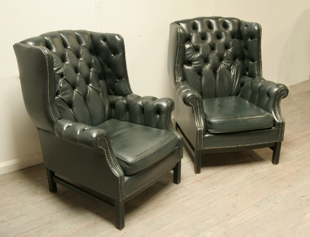 Pair Of Dark Green Leather Wing Chairs 